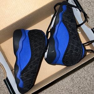 Black and blue Jordan 13s